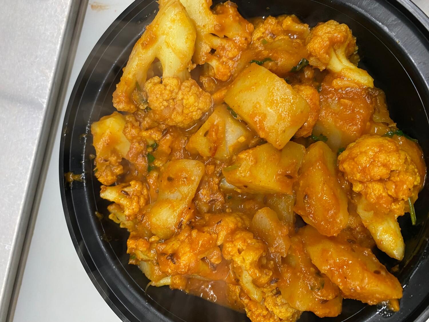 Aloo gobi — potato and cauliflower cooked with turmeric and cumin