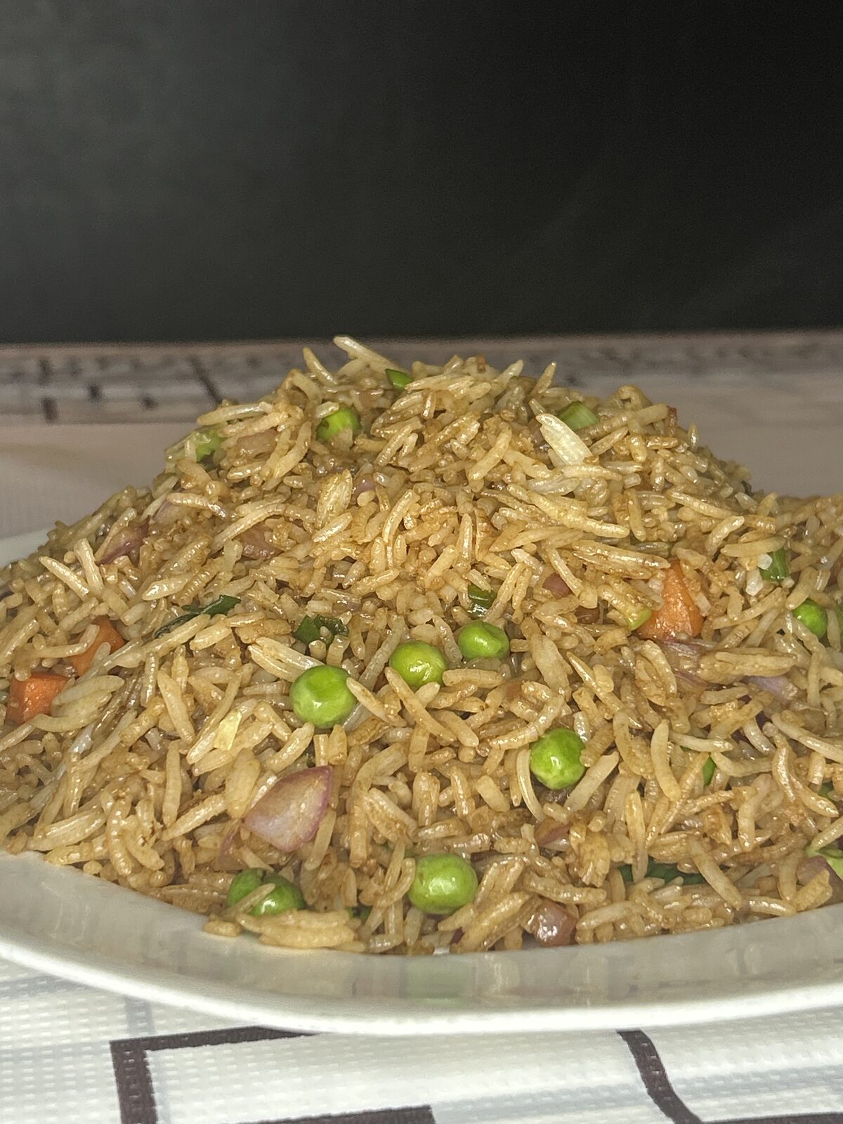 Indo-Chinese vegetable schezwan fried rice with peas and carrots