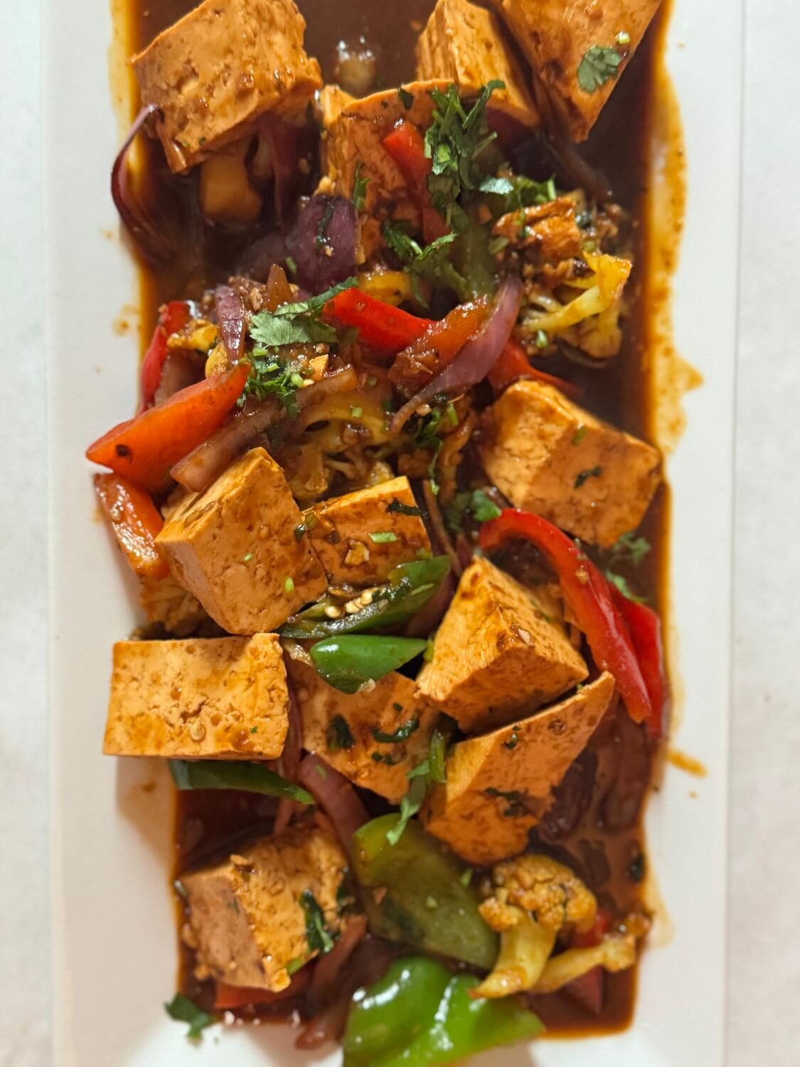 Chilli paneer with bell peppers, onions and Indo-Chinese sauce